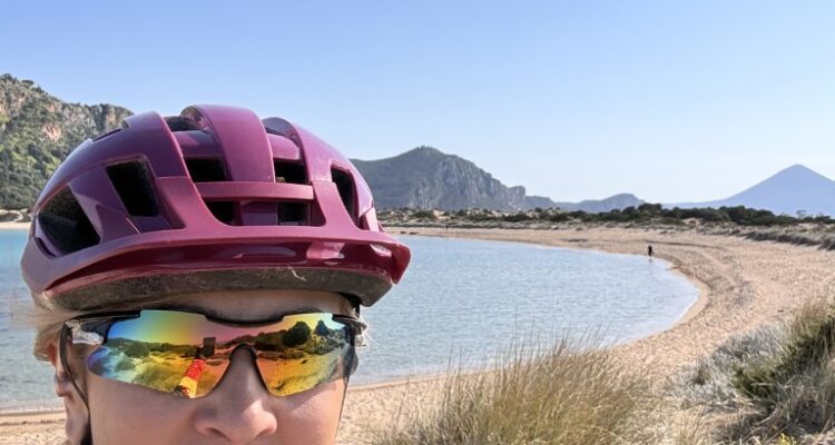 Lady on a bike in Voidokilia