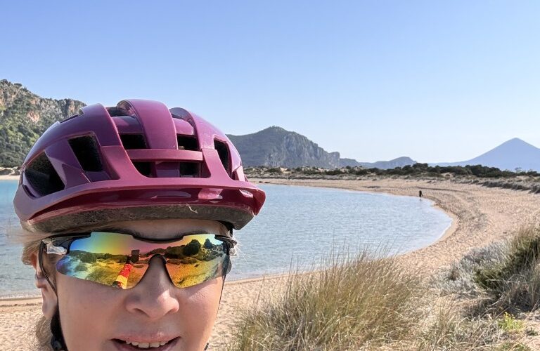 Lady on a bike in Voidokilia